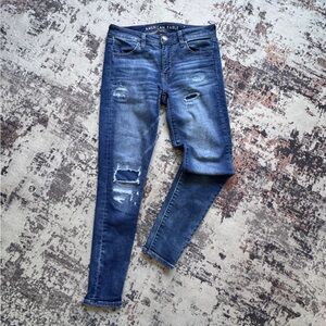 American Eagle Outfitters Dark Blue Distressed Jeggings - Size 4 Short